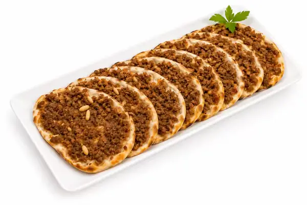 Sfiha with pomegranate molasses